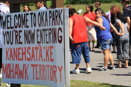 Over 100 people participated in a rally to mark the 23rd anniversary of the Oka Crisis and to tell Enbridge they are not welcome on Mohawk land. PHOTO: Arij Riahi.