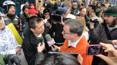Protesters outside of the Sun News studio in Toronto on January 19, 2013, confront, and are interviewed by, SN host Ezra Levant, who has been a vociferous critic of Idle No More and Chief Theresa Spence. PHOTO: Peter Biesterfeld.