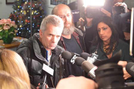 John Clarke (L) and Gaetan Heroux (R) make a statement to the media about the deaths of two homeless men in less than 24 hours and the mayors  agreement to declare an extreme cold weather alert. Photo by Darryl Richardson